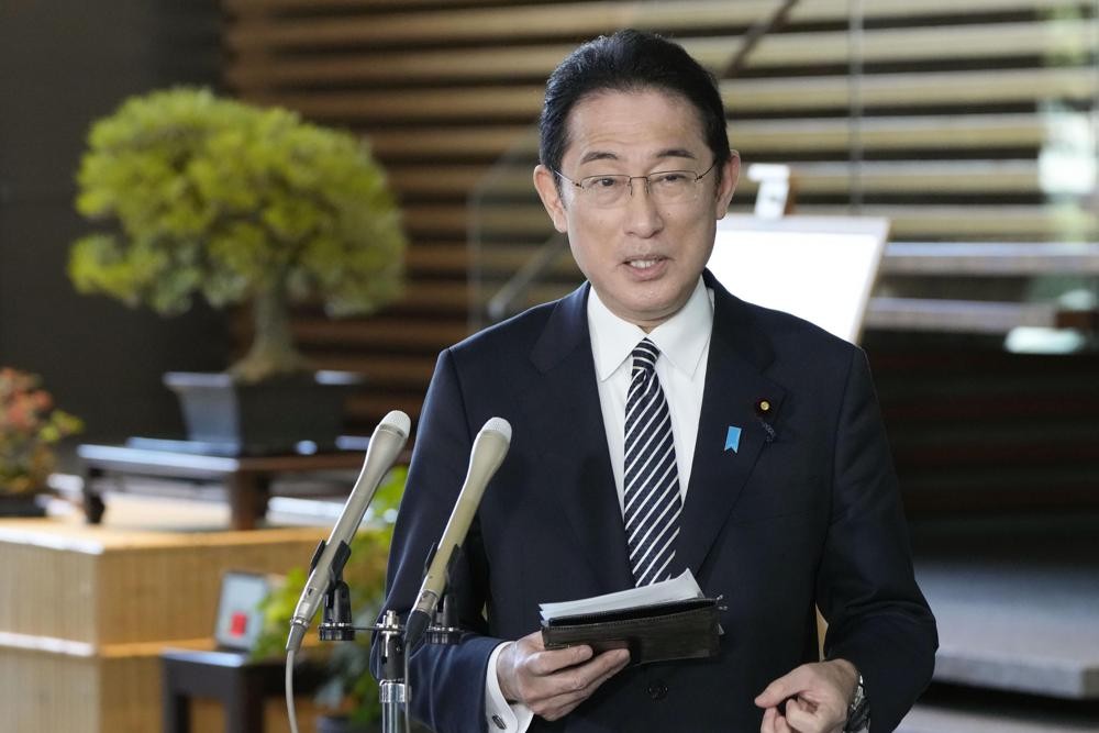 Japan’s Prime Minister Fumio Kishida answers to reporters' questions at his official residence in Tokyo Friday, March 11, 2022. Kishida and South Korea's president-elect Yoon Suk Yeol talked on the phone Friday, agreeing to cooperate toward improving their countries' ties, signaling a thaw in their icy relations strained by wartime history disputes. (Kyodo News via AP)
